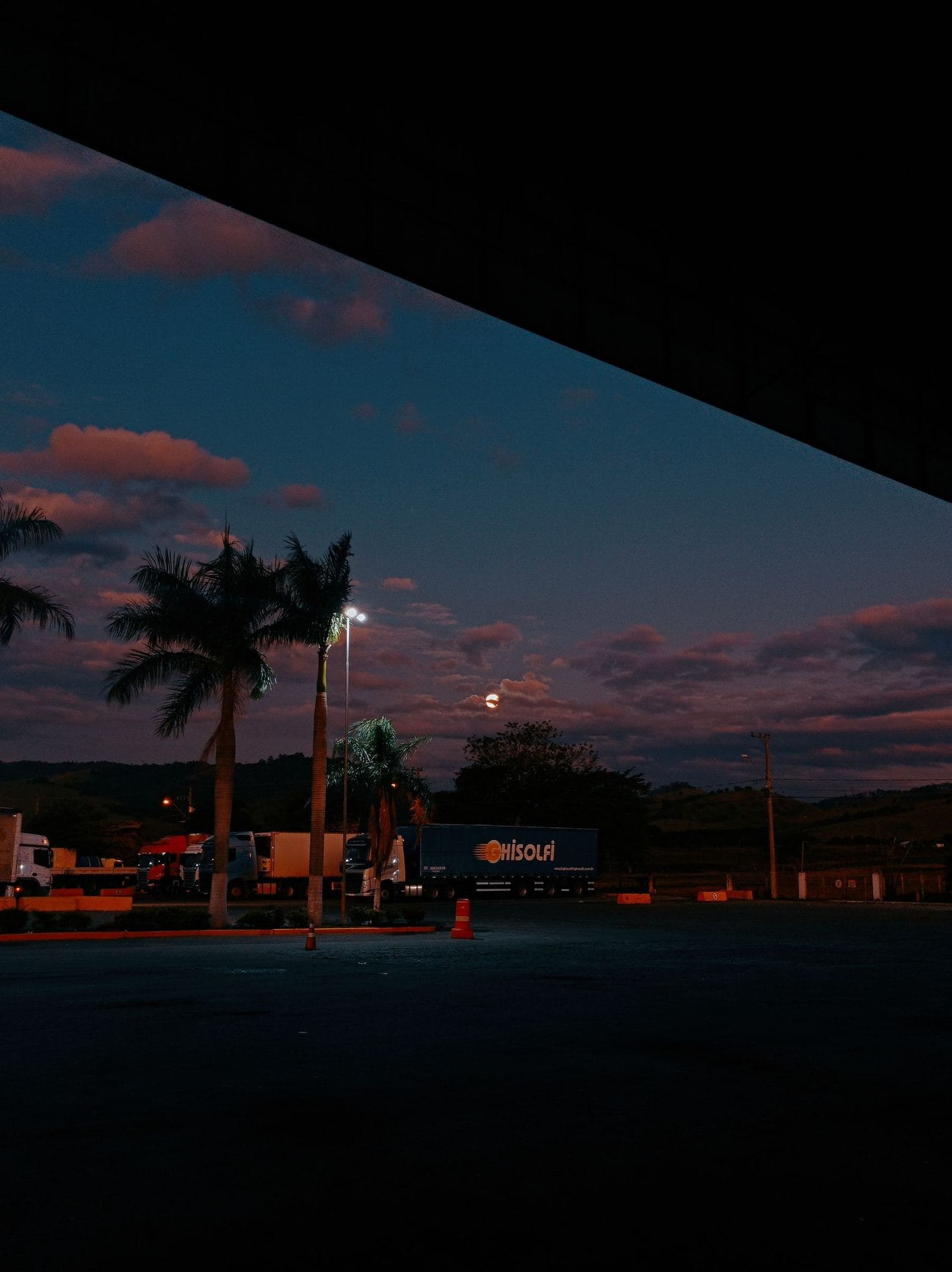 A truck stop at dusk, where overnight cargo theft happens